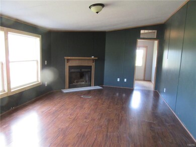 Family room, looking to side entrance and laundry 