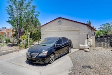 Garage with driveway and a gate