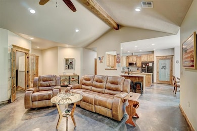 Living room with beamed ceiling, high vaulted ceil