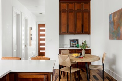 Dining area featuring wood finished floors and ba