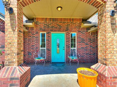 Property entrance featuring a patio area