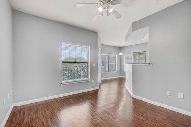 Empty room featuring dark wood finished floors an