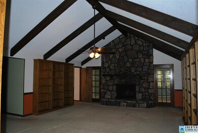 Large den with fireplace and TONS of built-ins