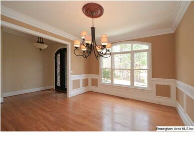 Dining room with chandelier and chair rail with sh
