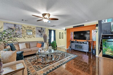 View of living room and entryway from the breakfast area.