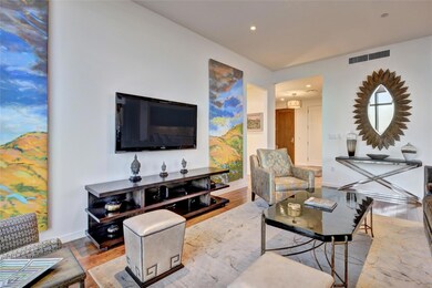 Living area with recessed lighting, baseboards, v
