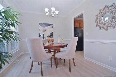 Dining room also offers updated light fixture, cha