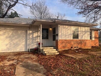 Ranch-style home with a garage