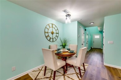 Dining room with visible vents, baseboards, and wo