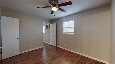 Unfurnished room featuring wood finished floors, a