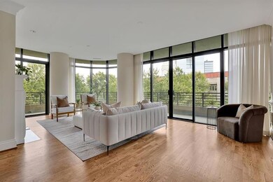 Living room featuring wood-type flooring and expan