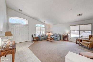 Living area featuring light tile patterned floors,