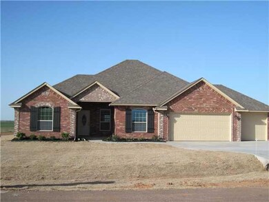 Exterior Front. Warm & inviting with large covered