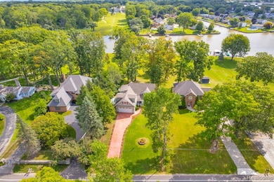 Aerial view of residential area featuring a large body of water