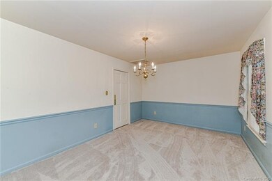Dining room with door leading to kitchen