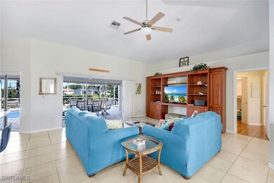 Living room with visible vents, baseboards, lofted
