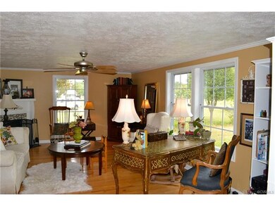 Living room has plenty of natural light, front and