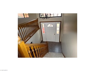 Foyer with view of ceramic entrance and new steel 