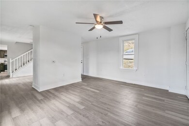 Another view of living room. Dining room to the le