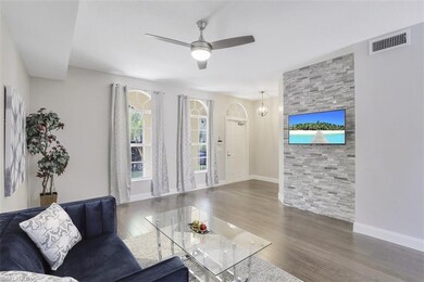 View of front living room with marble wall, tv, fr