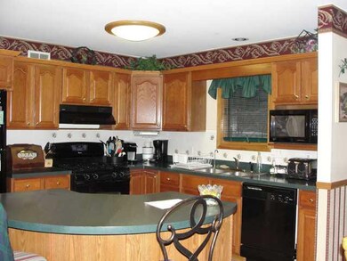 Kitchen Large kitchen with honey maple cabinets, c