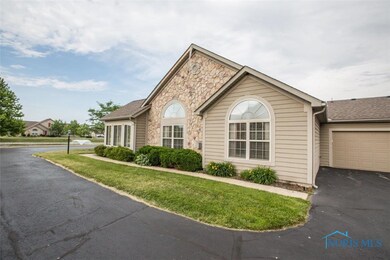 Side view of condo and garage