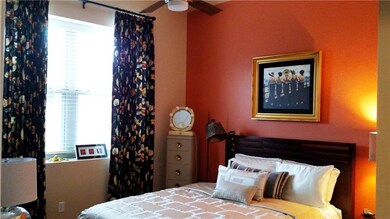 Spacious & bright bedroom! Ceiling light fan. Drap