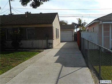 Long Concrete Driveway leading to Garage.