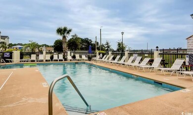 Community pool featuring a patio area