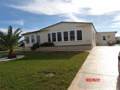 Take note of long decorated concrete driveway