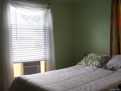 Bedroom featuring crown molding