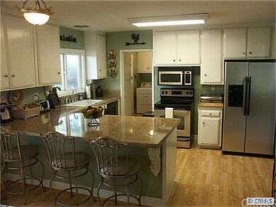 remodeled kitchen with granite counters opens to t