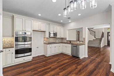 Kitchen featuring stainless steel appliances, dar