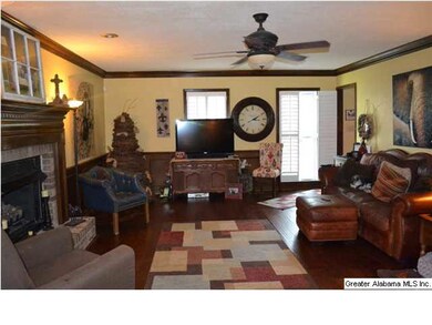 Cozy family room with gas fireplace. Plantation sh
