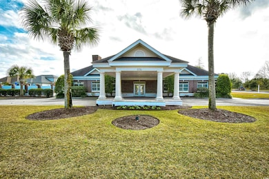 View of building exterior with curved driveway