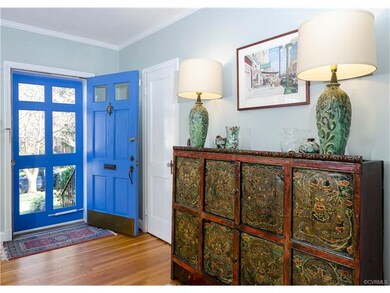 The front door opens to the spacious living room w