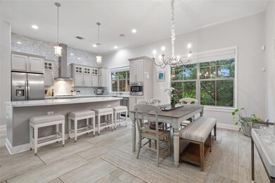 Dining space with a chandelier, baseboards, reces