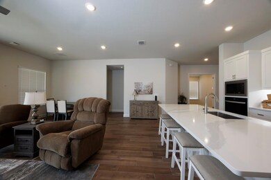 Living room featuring dark wood finished floors, 