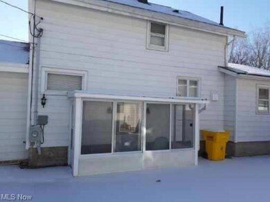Side of home sunroom. Driveway side