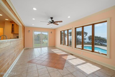 Spacious sunroom overlooking pool
