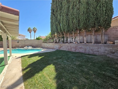 View of yard featuring a fenced backyard and a fen
