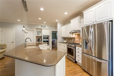 Spacious Kitchen w/Walk-in Pantry, Newer Appliances, Backsplash, and Freshly Painted Cabinets. Gorgeous !!