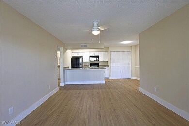 Unfurnished living room featuring visible vents, b