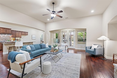 Living area featuring dark wood-style floors, rec