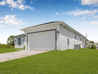 View of front of home featuring stucco siding, dri