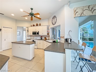kitchen has pass thru window to lanai for entertaining