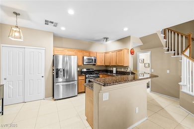 Kitchen with appliances with stainless steel finis