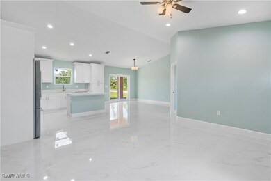 Unfurnished living room with light marble finish f