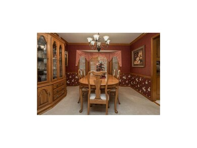The Formal Dining Room Provides Plenty of Room For Large Furniture & also Offers Fresh Carpeting, Crown Molding & a Bay Window with Plantation Shutters. (Wooden Hutch is Negotiable)