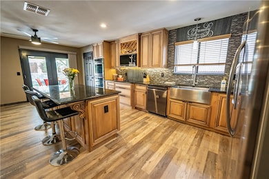 Kitchen with appliances with stainless steel finis
